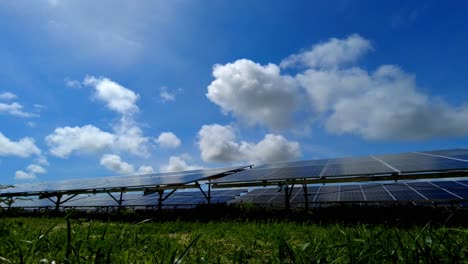 Beautiful-cinematic-low-angle-view-Time-lapse-of-Bifacial-Solar-panel-arrays-farm-at-TBEA-NAWEC-solar-power-plant-in-Jambur-Gambia,-West-Africa