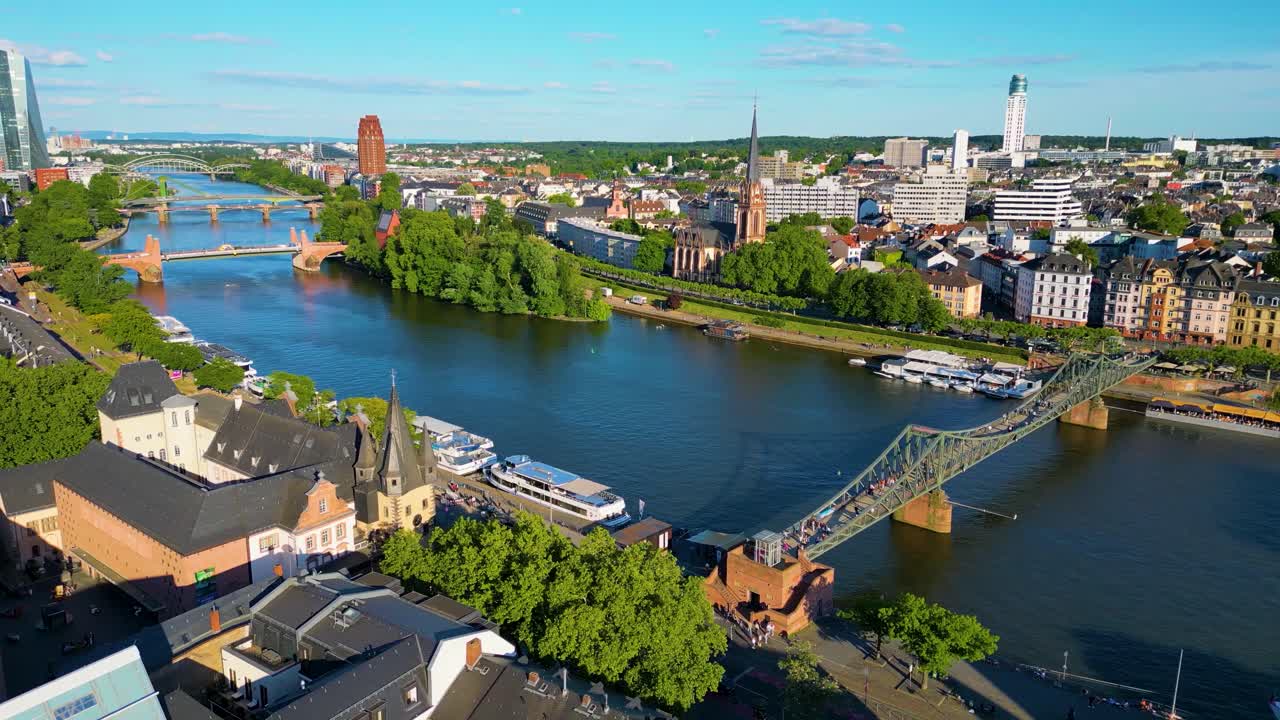 4K Drone Video of the Beautiful Historic Churches, Buildings, and Bridges on the Main River in Downtown Frankfurt, Germany (High Speed)