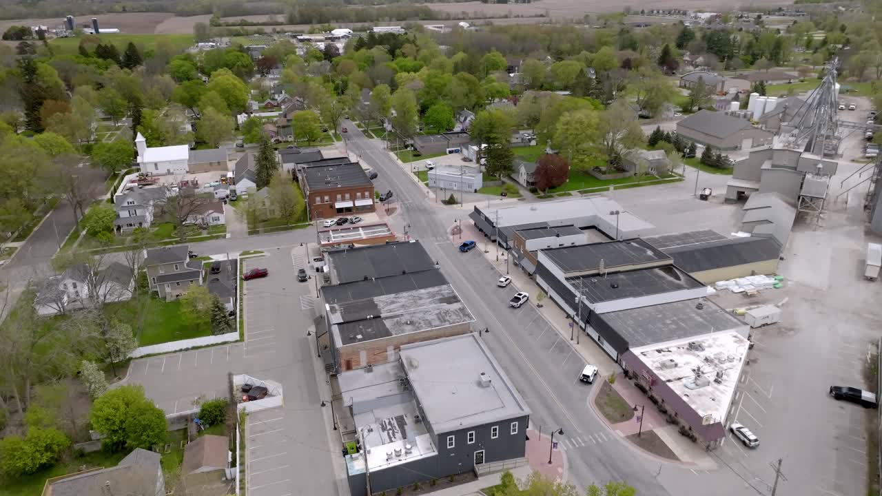 Downtown Caledonia, Michigan with drone video moving at an angle.