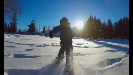 kid playing in the snow during winter 4k