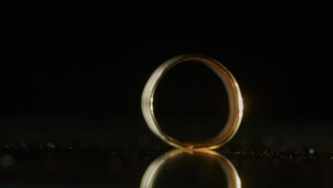 a gold ring of a scythian priestess 2000 years old, an old earring, a spinning wheel, found during excavations. vintage jewelry. religion. close-up