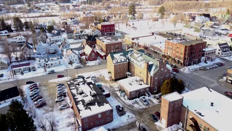 Drone-flying-over-the-center-of-town-in-Lyndonville,-Vermont