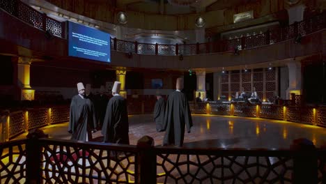 whirling dervishes, inside the sacred hall of the mevlana museum, visitors pause in reverence, taking in the peaceful atmosphere of this spiritual space in konya.