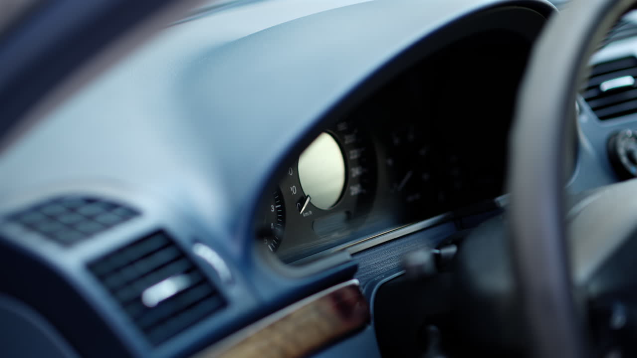 Close up of the dashboard and steering wheel of a car