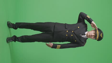 pilot saluting on green screen