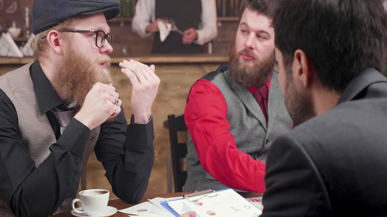 Businessmen having a meeting in a cafe