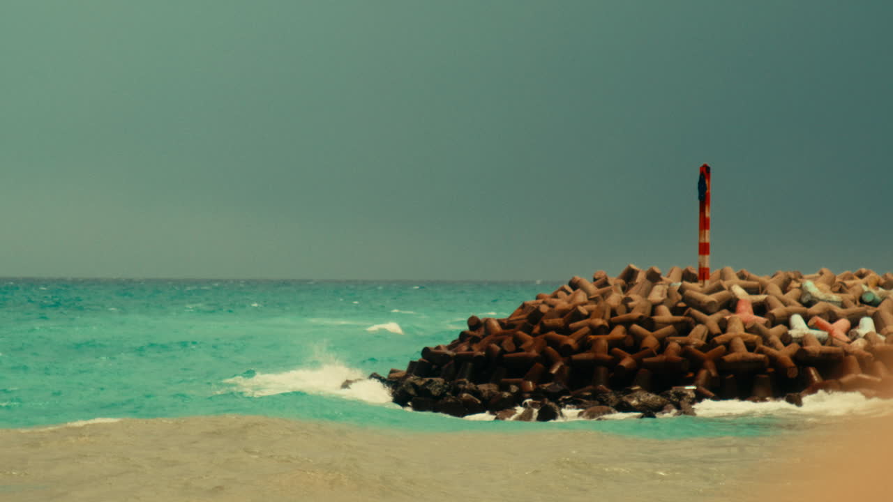 Coastal View with Breakwater and Turquoise Water