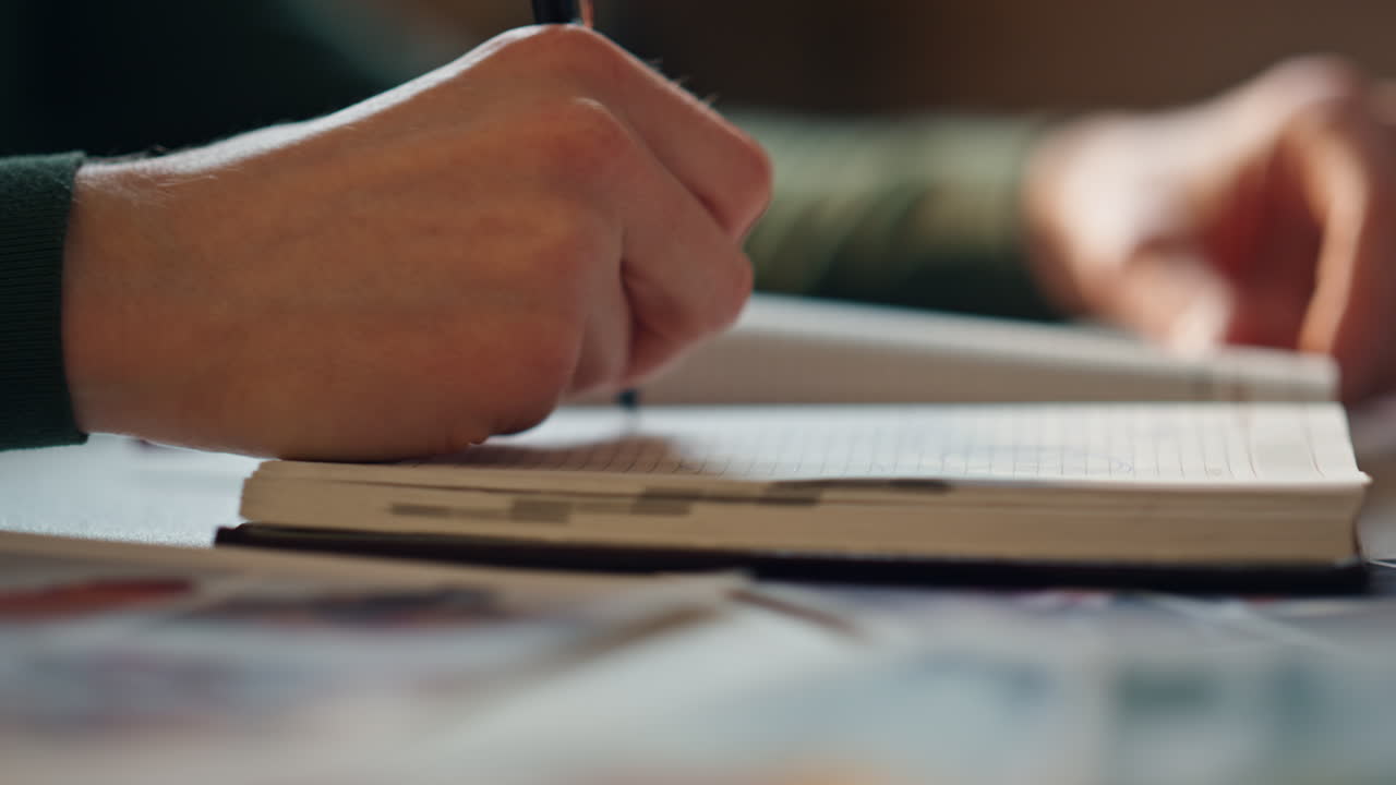 Woman hands closing notepad putting pen inside closeup. Girl finish noting plan.