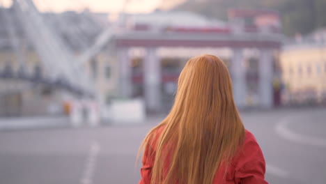 Young-Pretty-Red-Haired-Woman-Taking-Photos-Of-The-City-With-Her-Phone