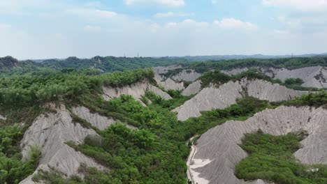 AERIAL-PANORAMA-VIEW-OF-MOONSCAPE-SCENERY-with-VEGETATION-during-CLOUDY-DAY,-Tianliao-Moon-World,-田寮月世??