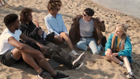 Lounging-happy-friends-on-beach