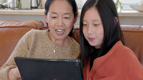 asian mom, girl on tablet video call