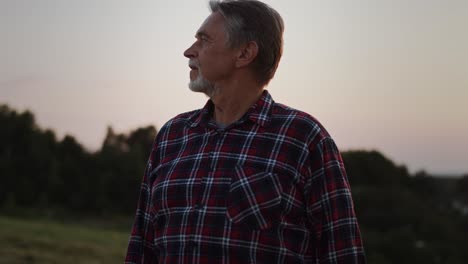 video of proud senior man looks over his land