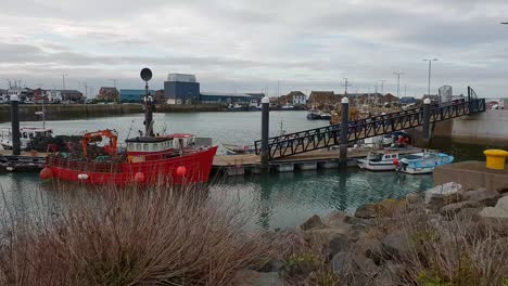 small pier with fisher boats in howth