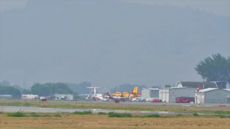 a squadron of firefighting aircraft at kamloops airport ready to combat the ross moore lake wildfire