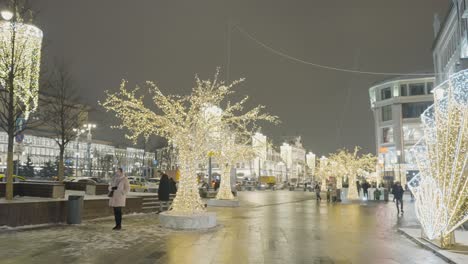 christmas decorations on a city street at night