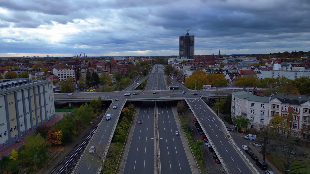 Urban landscape showing a major highway system in Berlin Steglitz with dramatic clouds. Great aerial view flight fly push forward overflight flyover drone
