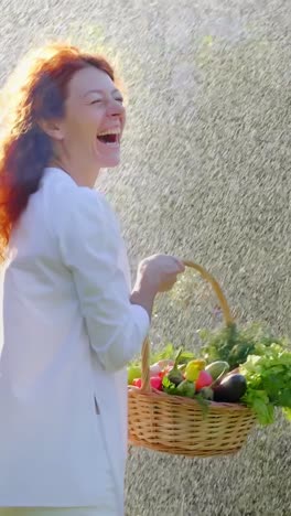 woman laughing in the rain with a basket of vegetables