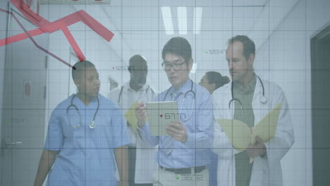 medical team walking hospital corridor, tapping tablet and tracking health data charts and grids