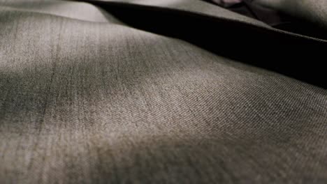closeup of an expertly tailored suit that beautifully showcases its sophisticated buttons and fine fabric texture
