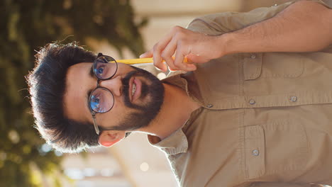 young man talking on phone outdoors