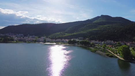 lake orestiada region of macedonia, kastoria city in greece aerial, sun reflection