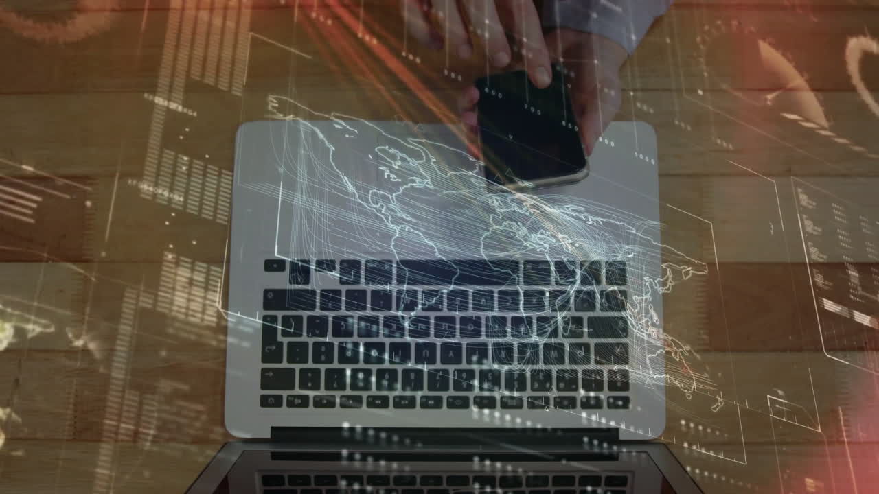 Streaming holographic world map and data over laptop keyboard while smartphone hovering above desk