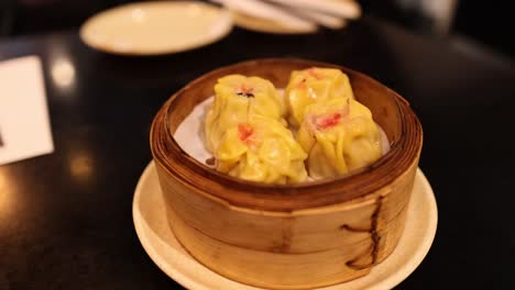 delicious dumplings served in a bamboo steamer