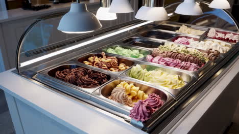 a vibrant display of various gelato flavors in a dessert shop