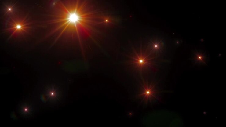 Stelle scintillanti animate e bagliori dell'obiettivo su sfondo nero