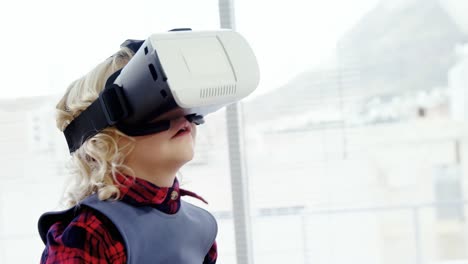 Kid-as-business-executive-using-virtual-reality-headset-4k