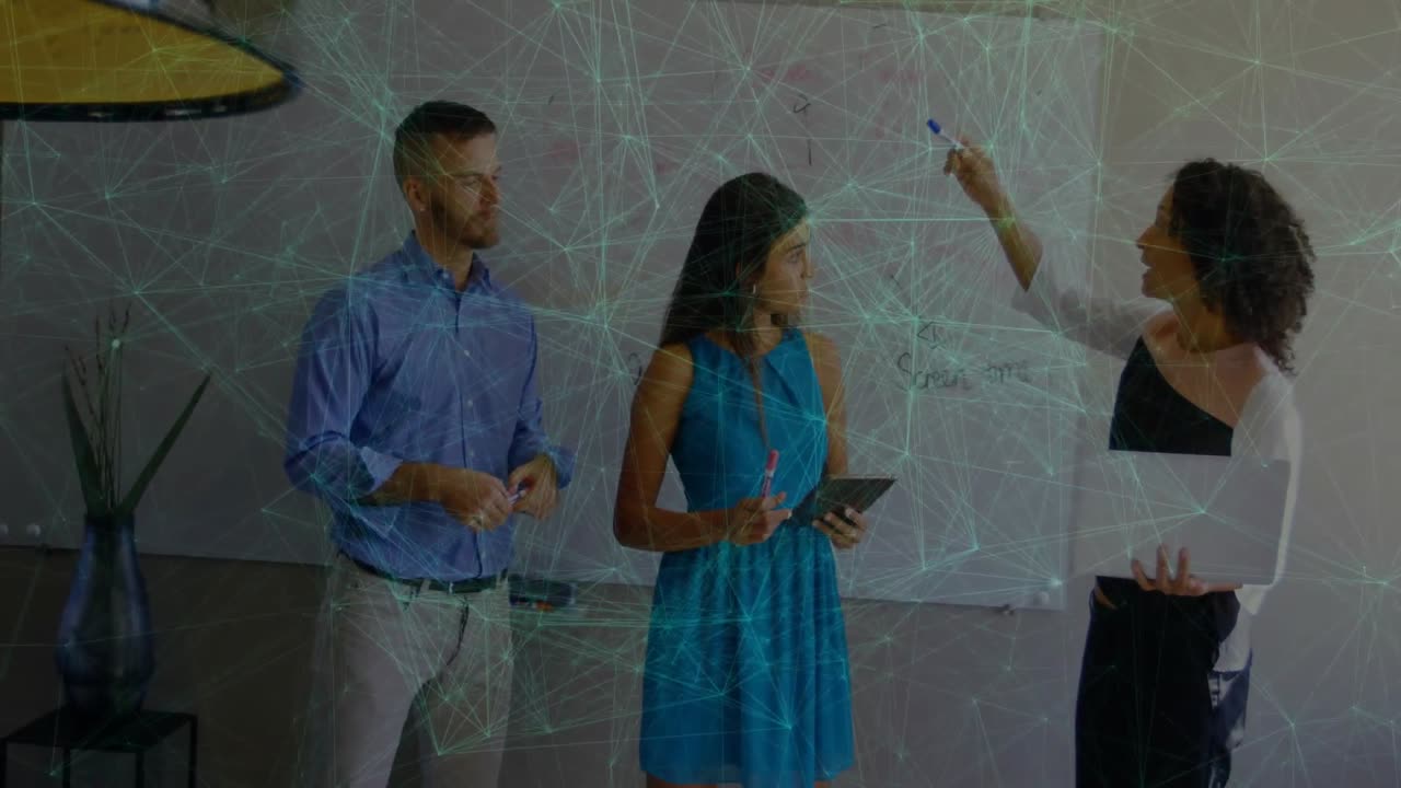 Presenter raising marker writing list on whiteboard colleague tapping tablet for business planning