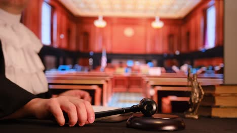 a judge firmly holds a gavel in a courtroom, symbolizing the principles of justice and the legal system