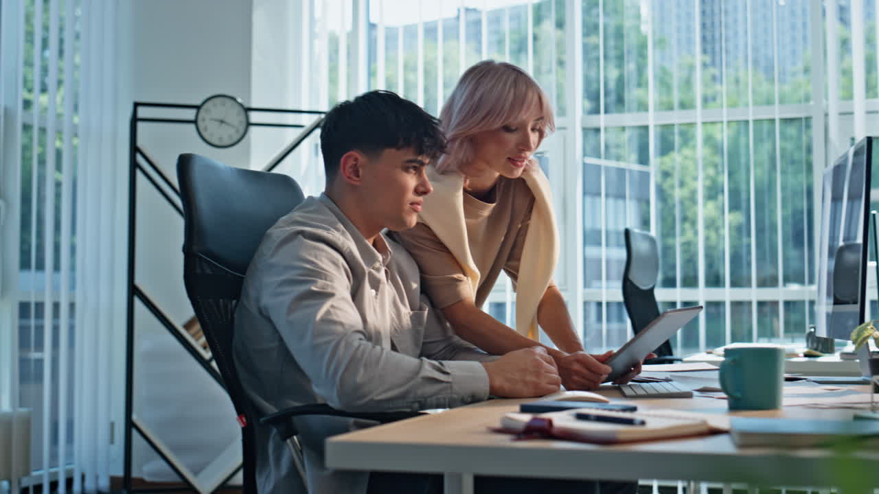 Businesswoman talking tired colleague at cabinet closeup. Man woman working