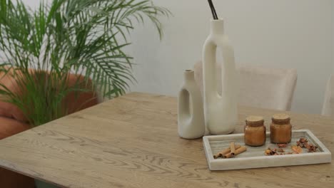 modern dining table decor with vases and candles