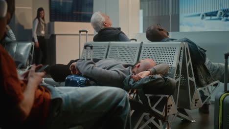passengers sleeping in airport lounge