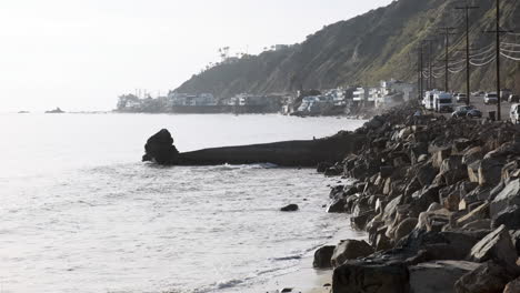 serene rocky stone shoreline next to a edge road on big rock malibu beach california