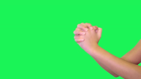 señal de mano de mano femenina delante de la pantalla verde.