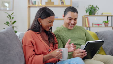 Love,-couple-with-tablet-and-on-sofa-happy