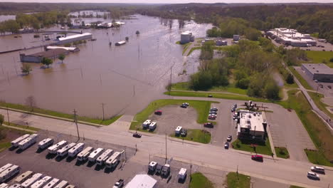 aerial shot of car traffic by flooded county fair area in ionia, michigan