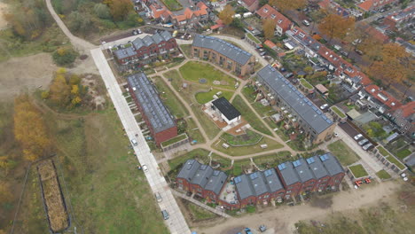 high angle aerial of a new suburban neighborhood with solar panels on rooftop