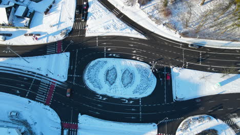 aerial view on a complicated multilane circular road intersection in gdansk, poland on a winter snowy day