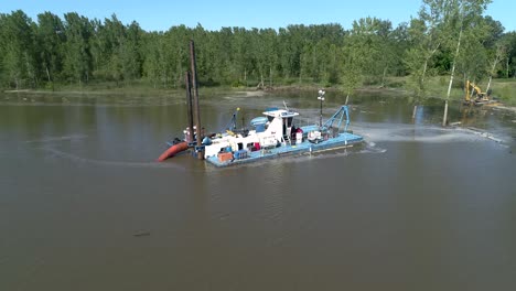 fly out from dredge to reveal river and complete site