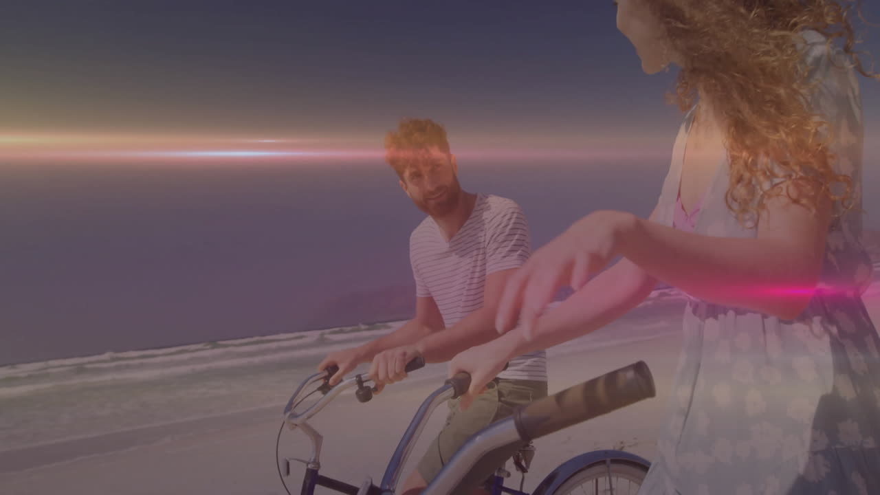 Man and woman cycling on beach at sunset, illustrating health featuring floating heart icon + graph