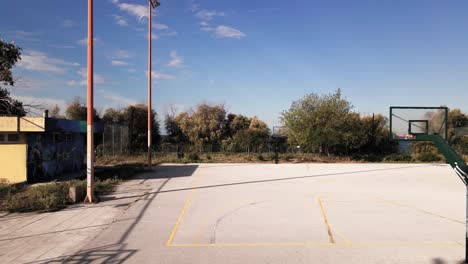 4k sideways moving drone clip over a basketball court in a sports complex in thessaloniki, greece