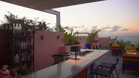 rooftop bar with ocean view at sunset