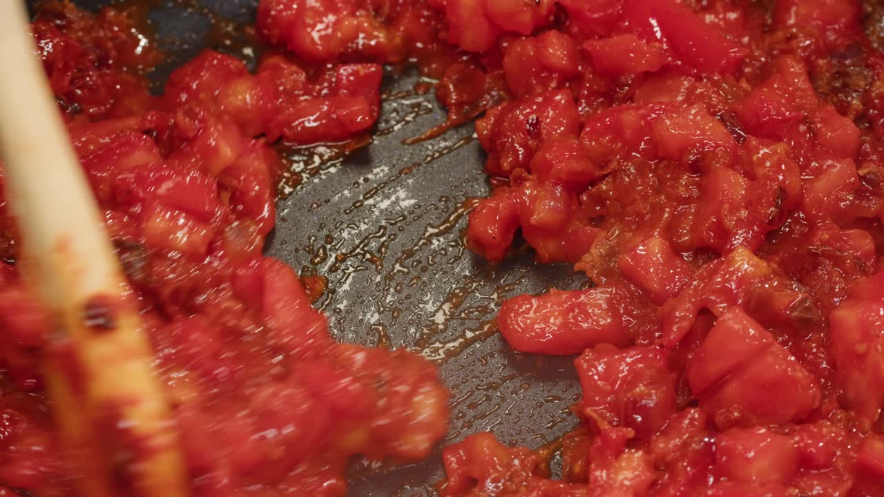 Cooking tomatoes in a pan
