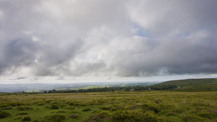 Panoramic View of a Cloudy Hillside Landscape