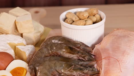 variety of protein sources on wooden background