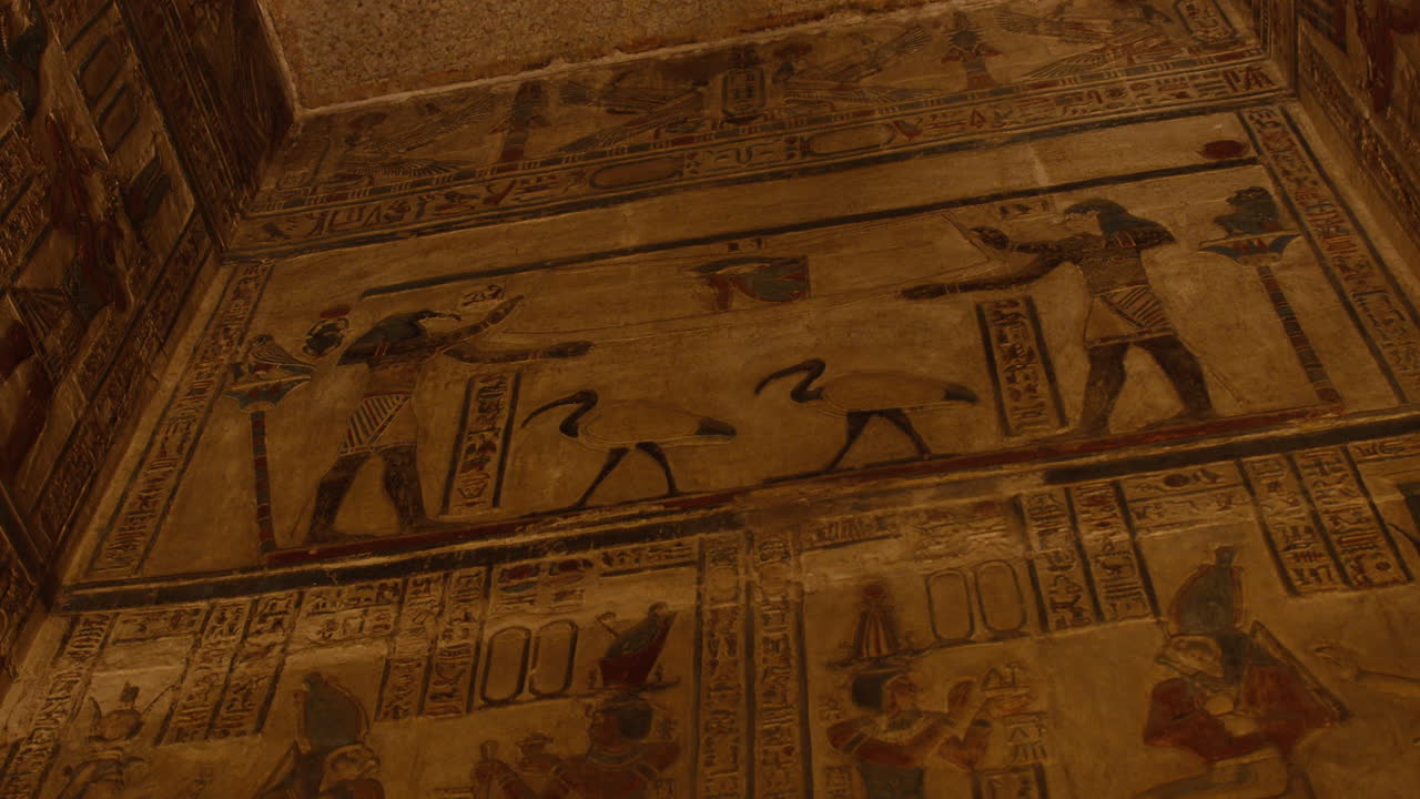 Ancient Egyptian gods on wall painting inside the Temple of Dendera, Egypt